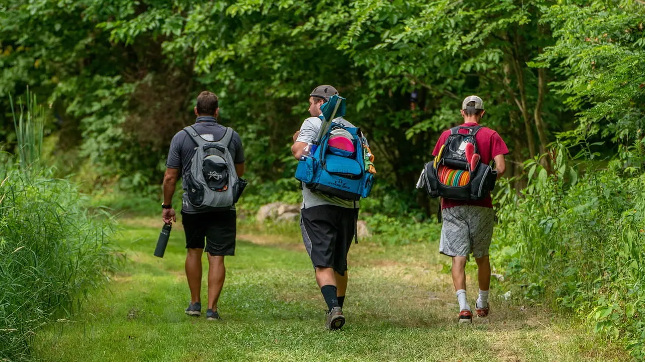 Disc golfers walking on course together